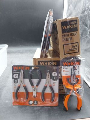 a box of scissors and a pair of pliers sitting on a table
