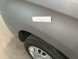 a sticker on the side of a car with a sticker on it
