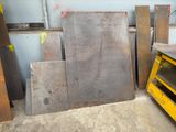 several pieces of metal are stacked up in a room