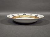 a close up of a bowl on a table with a gray background
