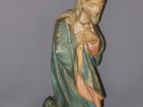 a statue of a woman holding a baby in her arms