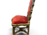 a small chair with a red cushion on top of it