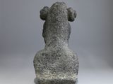an image of a stone statue of a dog on a gray background