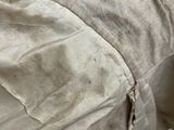 a bed that has a blanket on it in the snow