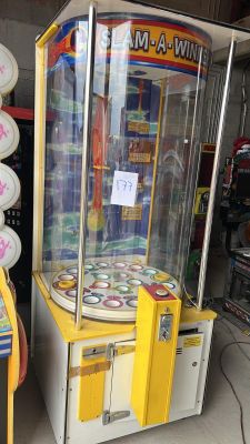 two machines that are sitting next to each other in a room