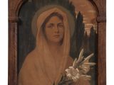 an old picture of a woman with a veil holding a flower