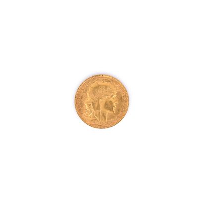 une image représentant une pièce d'or sur laquelle figure le portrait d'une femme