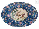 an image of a blue plate with a picture of a deer on it