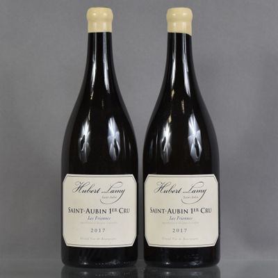 two bottles of wine sitting on top of a table