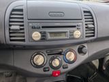 a dashboard of a car with a clock on it