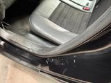 a picture of the inside of a car with the door open