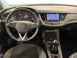 a picture of the interior of a car with a steering wheel and dashboard