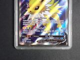 an image of a pokemon card with a yellow and white face