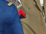 two jackets that are on display on a rack