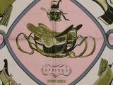 a pink and green scarf with a picture of a horse and carriage