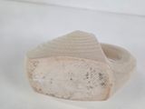a wooden ring that has a piece of wood in it