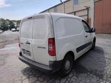 a white van that is parked in a parking lot