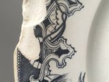 a close up of a plate with a design on it