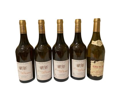 six bottles of wine sitting next to each other on a white surface