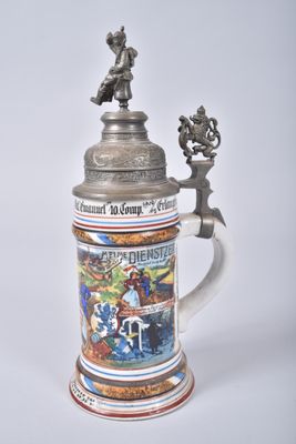 a beer mug with a picture on it sitting on a table