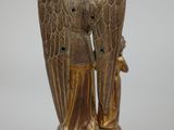 an image of a statue of an angel with a bird on it ' s back