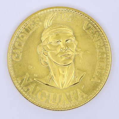 gold coin with a portrait of a woman wearing a headdress
