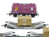 four different types of train cars with boxes on them