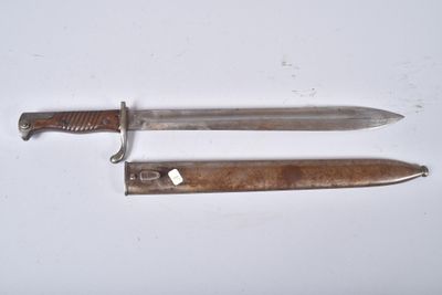 two knives that are laying on a white surface