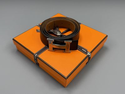 an orange box with a black belt on top of it