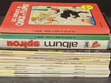 several children ' s books stacked on top of each other on a table