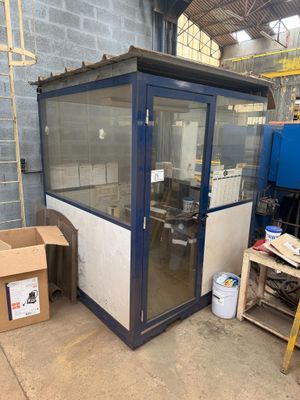 an image of a room with a glass door and a box of boxes