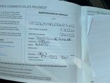 a document with a picture of a person ' s identification on it