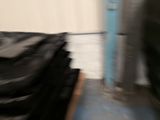 a blurry photo of a pile of black bags