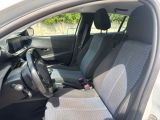 the interior of a car with a steering wheel and a seat belt