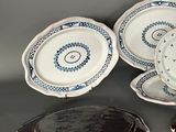 three plates and a cake on the table