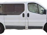 a white van that is parked on the side of the road