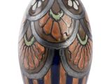 a vase with a design on it on a white background