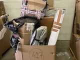 many cardboard boxes stacked on top of each other in a room