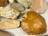 a pile of rocks and stones on a white surface