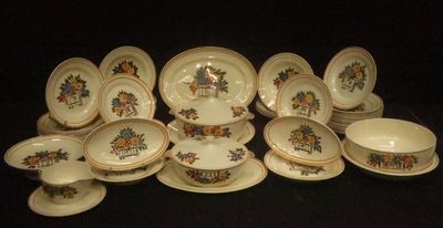 many plates and bowls that are sitting on a table