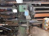 a machine that is sitting in the middle of a pile of wood