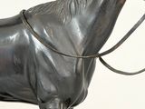 a statue of a horse with a bridle on it ' s head