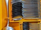 many spoons and spoons in a yellow box