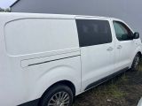 a white van that is parked on the side of the road