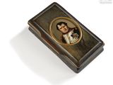 a picture of a small box with a picture of a man and a dog
