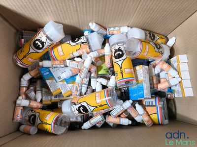 a cardboard box filled with many different types of toothpaste