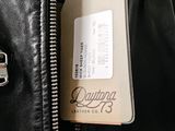 a leather jacket with a tag attached to it