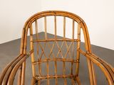 a wicker chair that is sitting on the floor