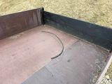 a black box with a hose in it sitting on the ground