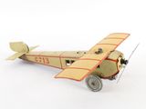 a toy airplane that is sitting on a white surface